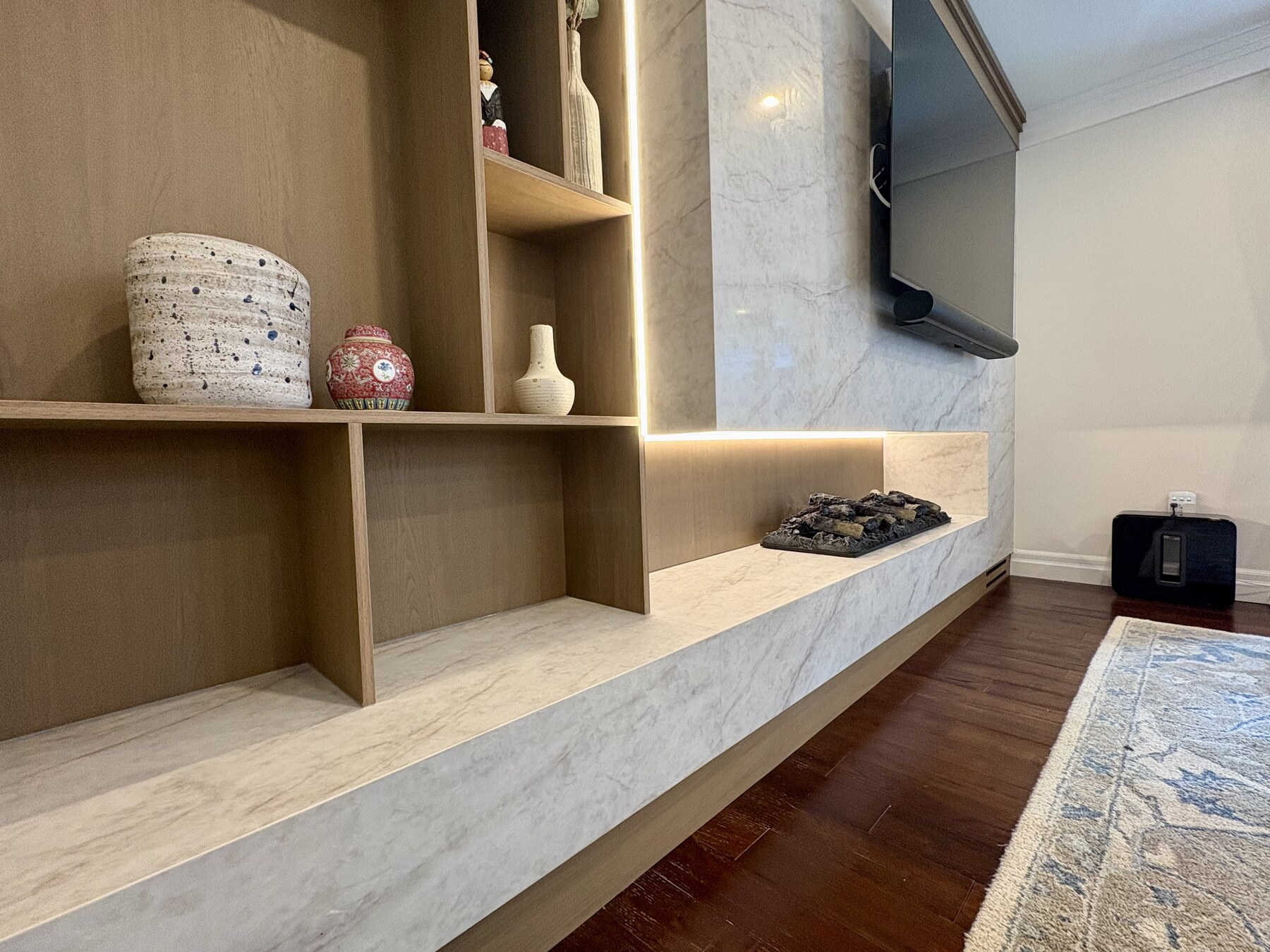 Floating stone hearth and lower shelving detail